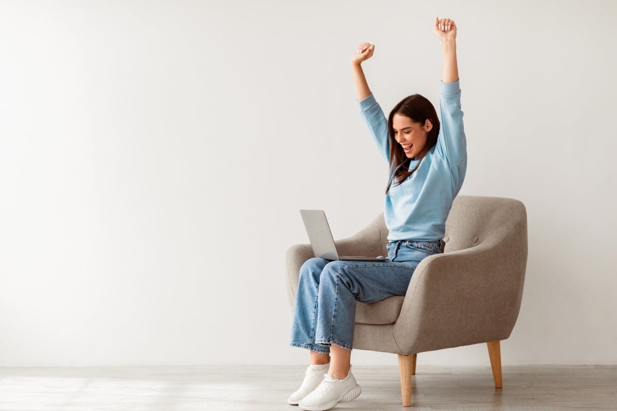 Happy woman with a laptop