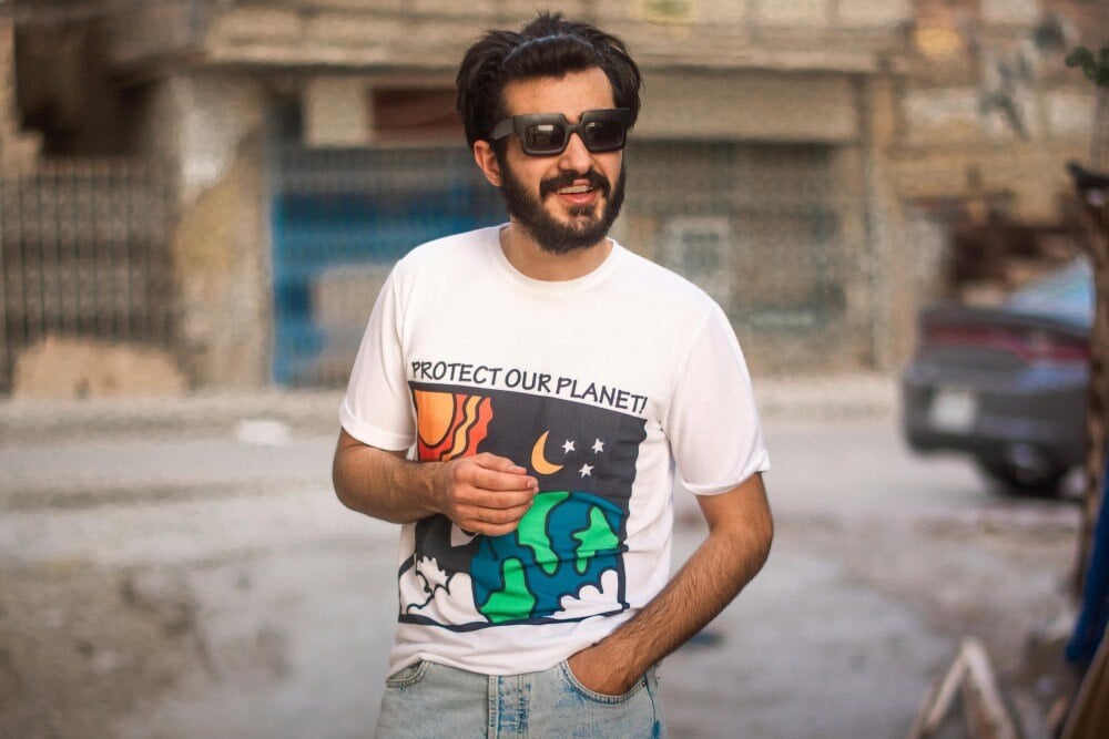 Man wearing a protect our planet t-shirt