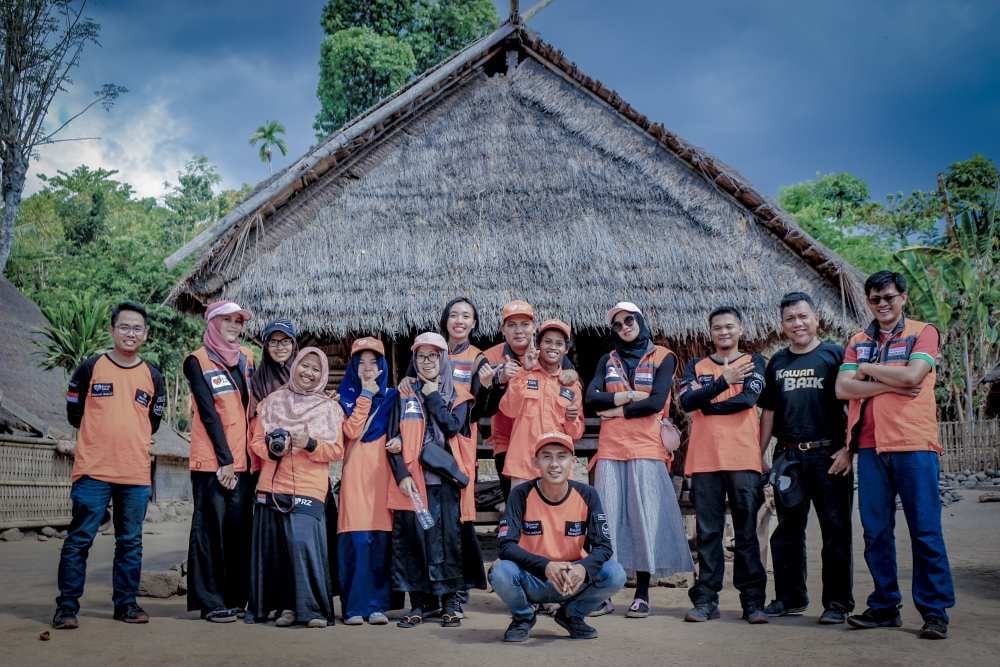 Nonprofit volunteer team in orange shirts