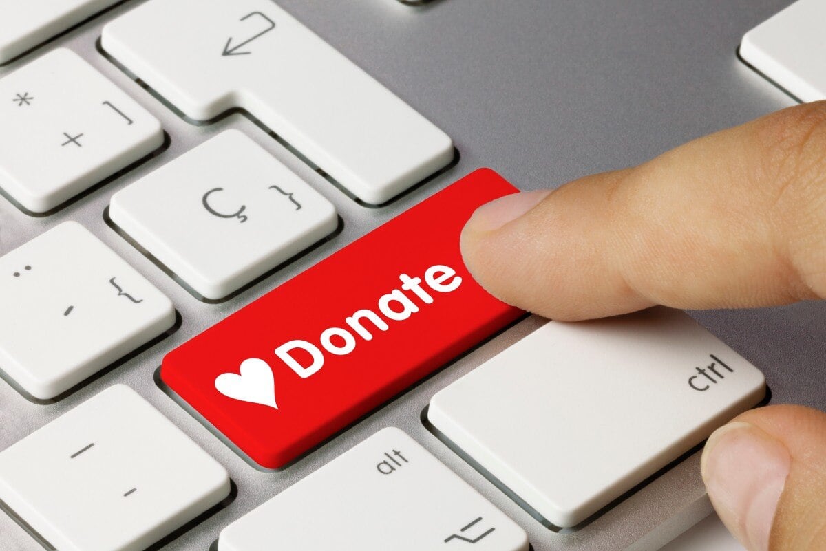 Red donate button on a laptop keyboard