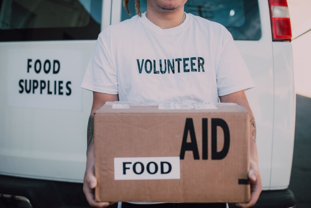 Volunteer carrying food package