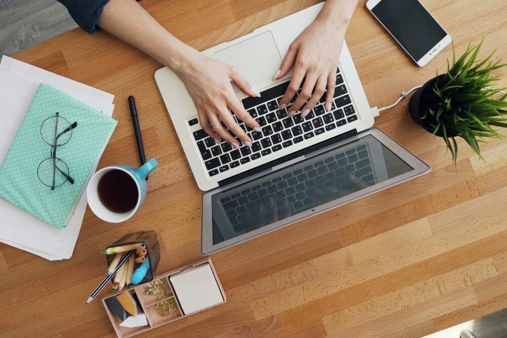 Woman working on a laptop at a desk