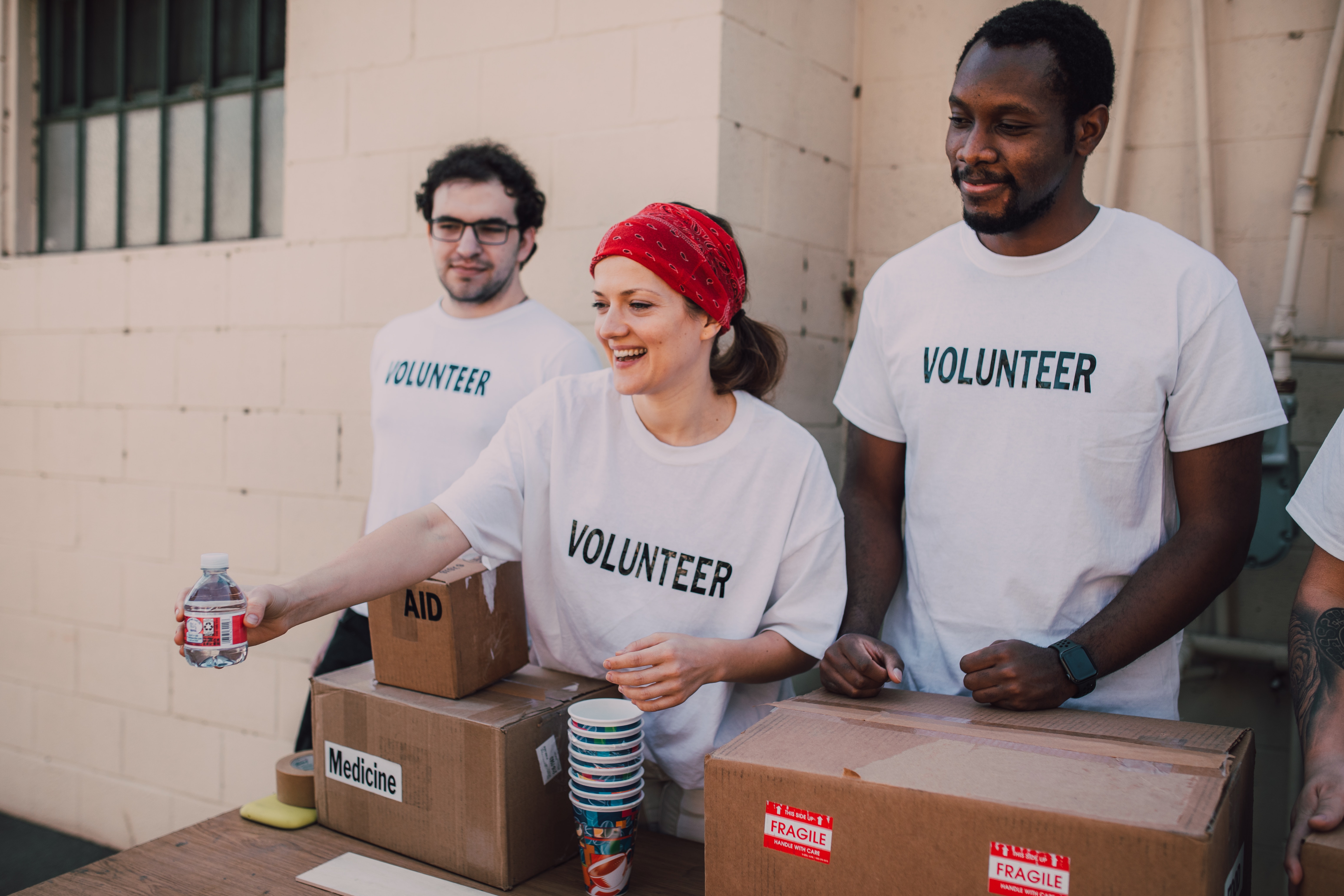 charity volunteers giving out medicine